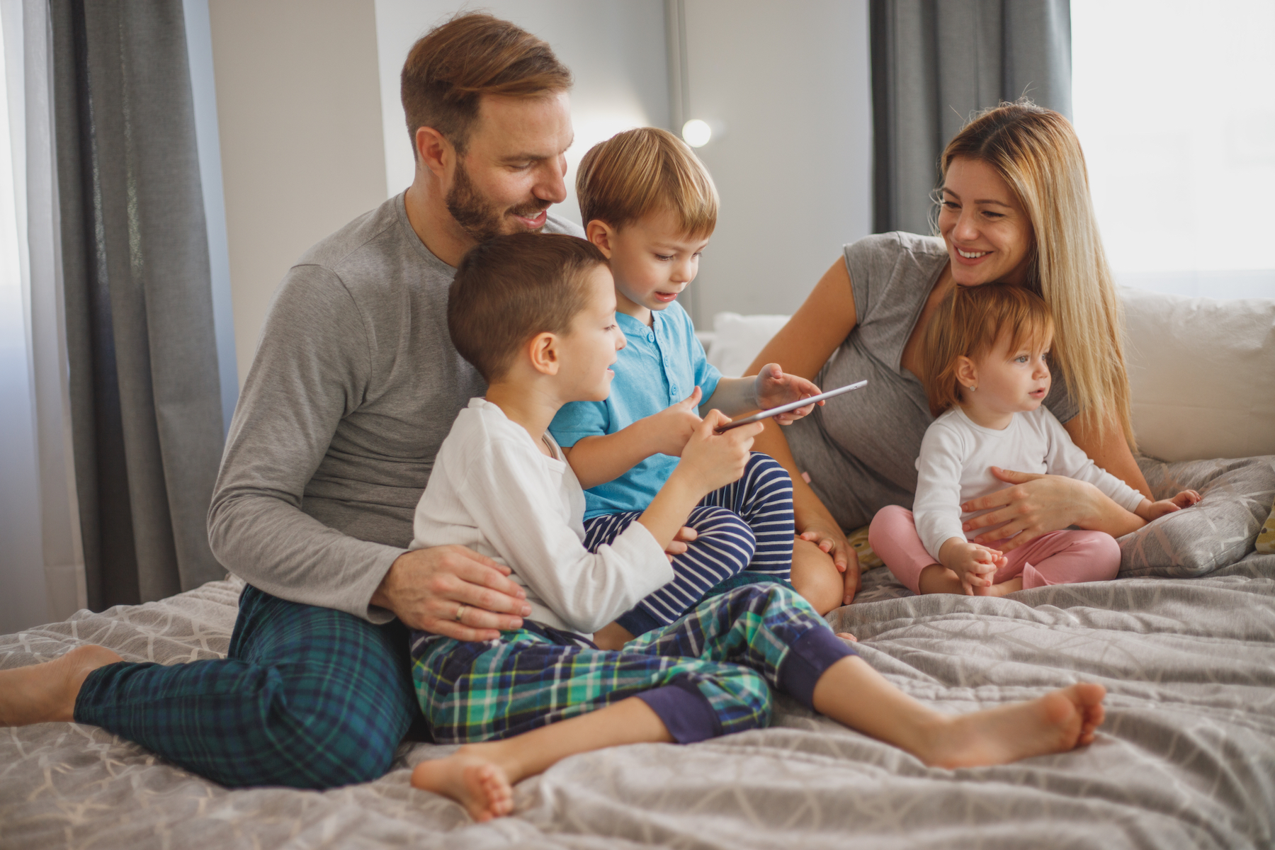 Family using tablet, enjoying Internet from a provider in East Baton Rouge Parish